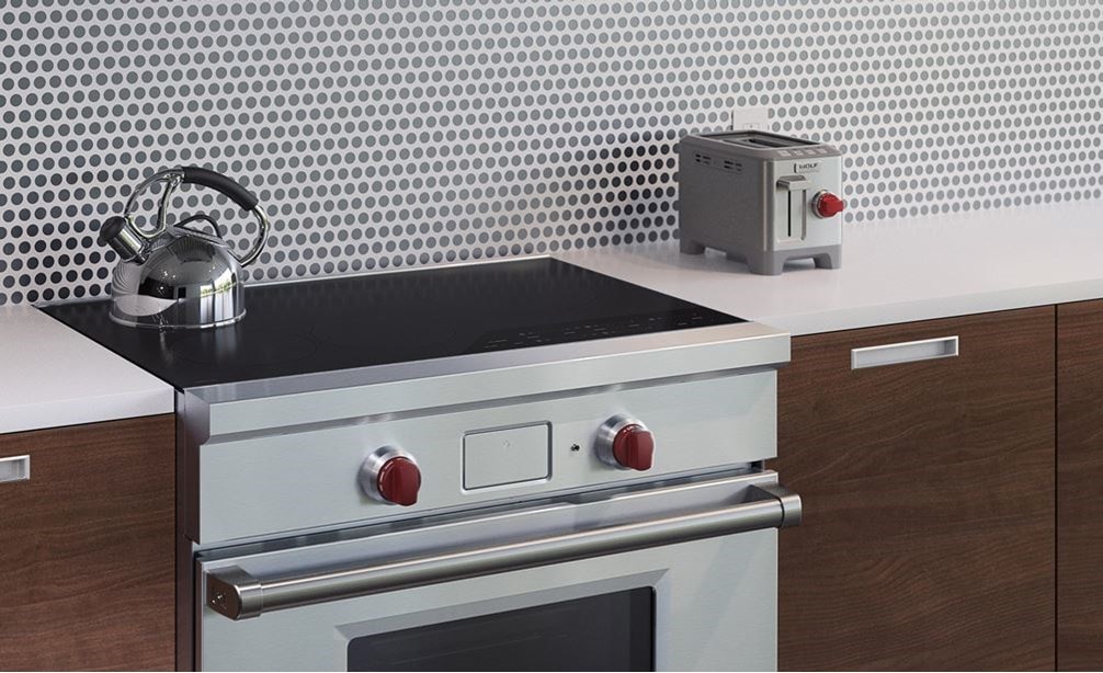 The Wolf 36&quot; Professional Induction Range (IR365PE/S/PH) shown with Wolf Two-Slice-Toaster with Red Knob (WGTR102S)