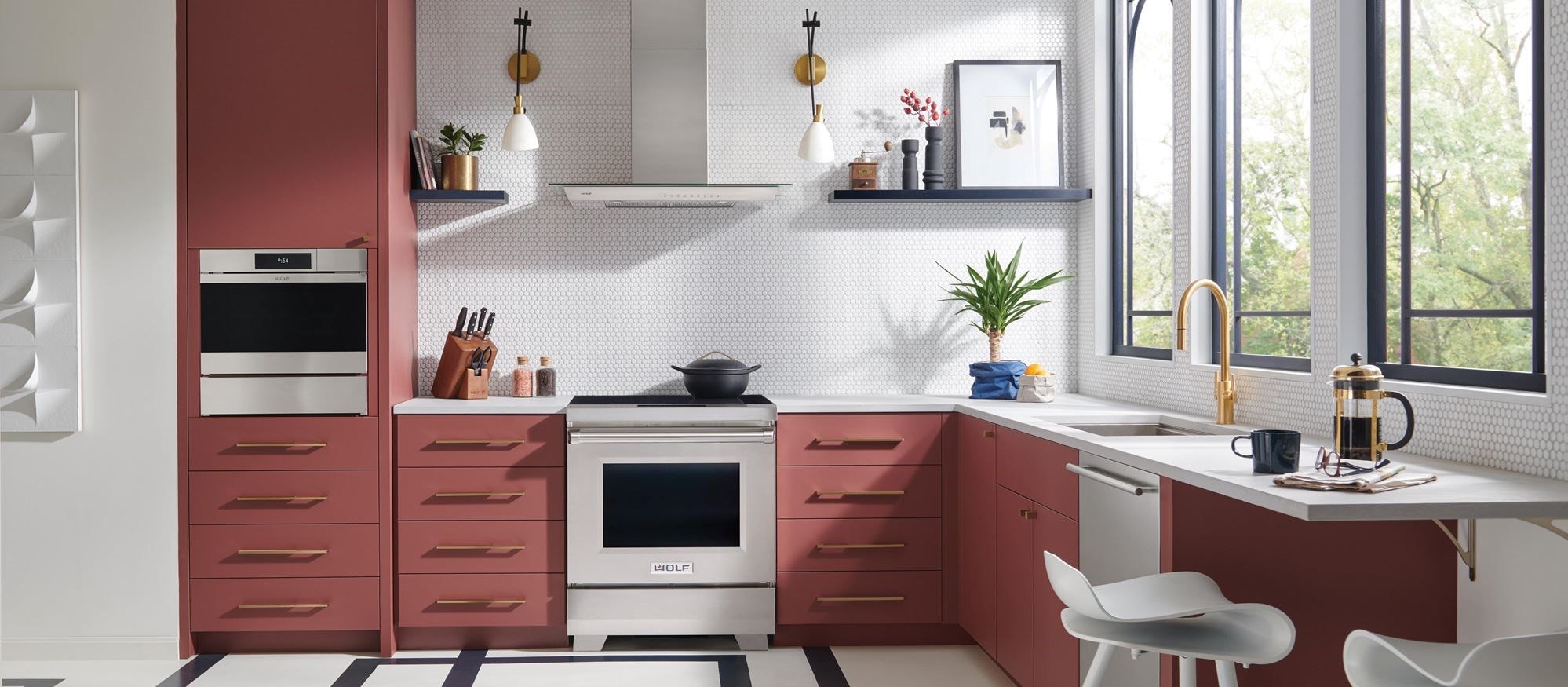 Wolf 30" Professional Induction Range (IR30450/S/P) featured in salmon cabinetry kitchen with geometric flooring.