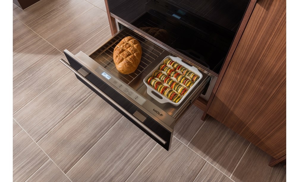 The Wolf 30" Warming Drawer (WD30) shown displaying hidden electronic controls that are easy to see and use when you pull out the drawer.