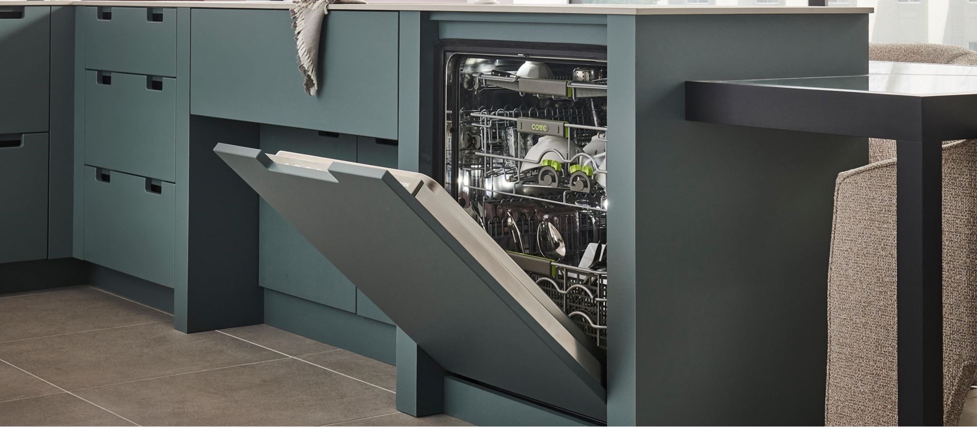 24 inch ADA Height Compatible Panel Ready Dishwasher (DW2451/ADA) by Cove Dishwashers disappears seamlessly with green panel ready door.