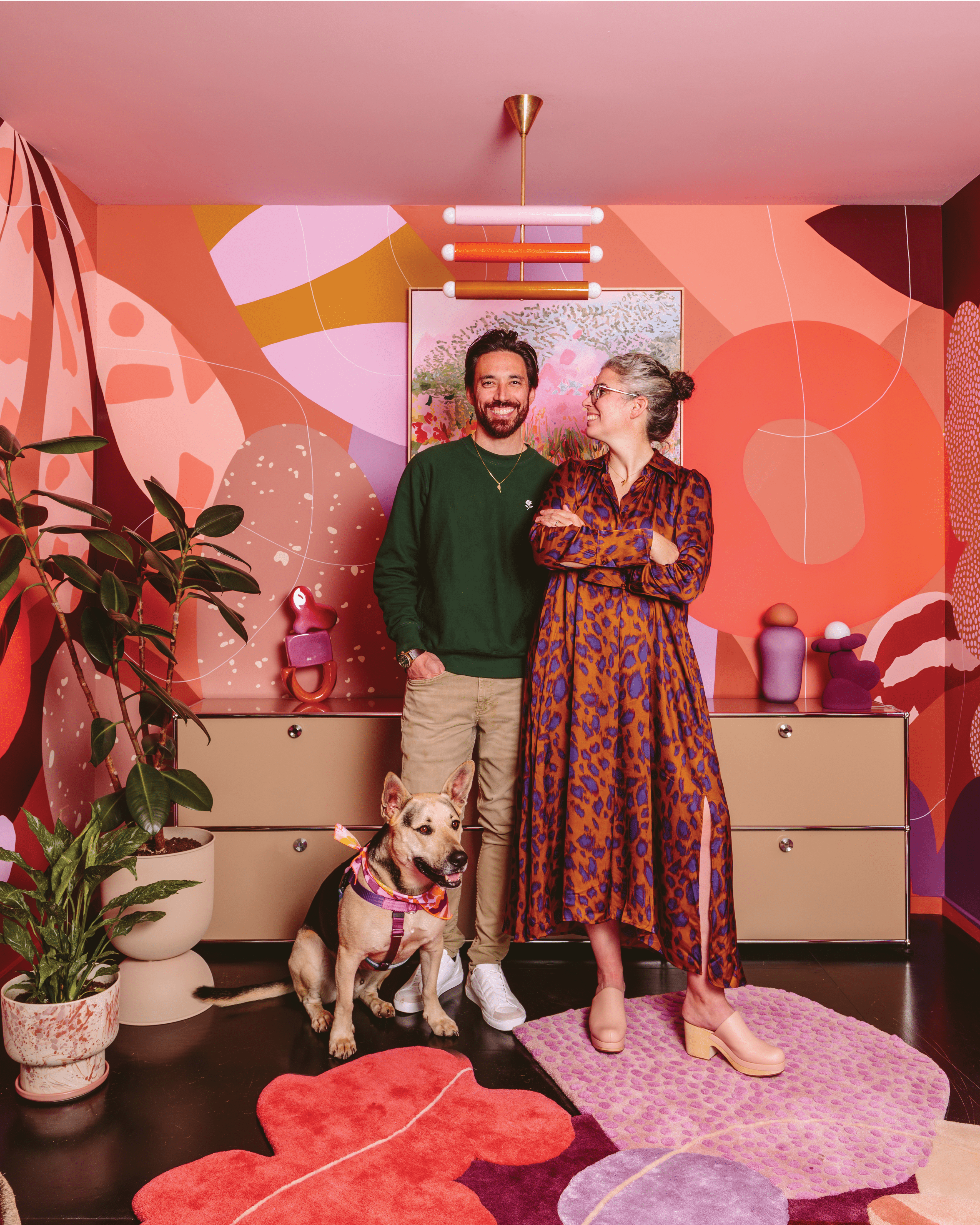 Artist Alex Proba, known for her colorful creations, pictured right, at home with her partner, Ian Coyle, pictured left.