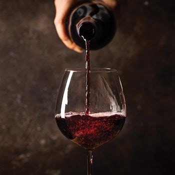 A cavern-like wine cellar for storage and celebration is the centerpiece of a New England home.