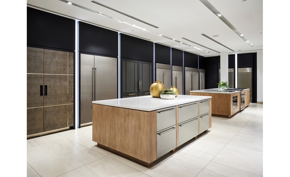 A wall of built-in Sub-Zero refrigerators in different shapes, configurations, and sizes. 