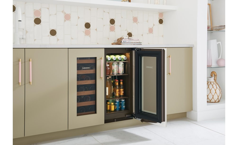 Side view of four full shelves stacked with an assortment of drinks in Sub-Zero 15" Designer Undercounter Beverage Center - Panel Ready (DEU1550BG) 