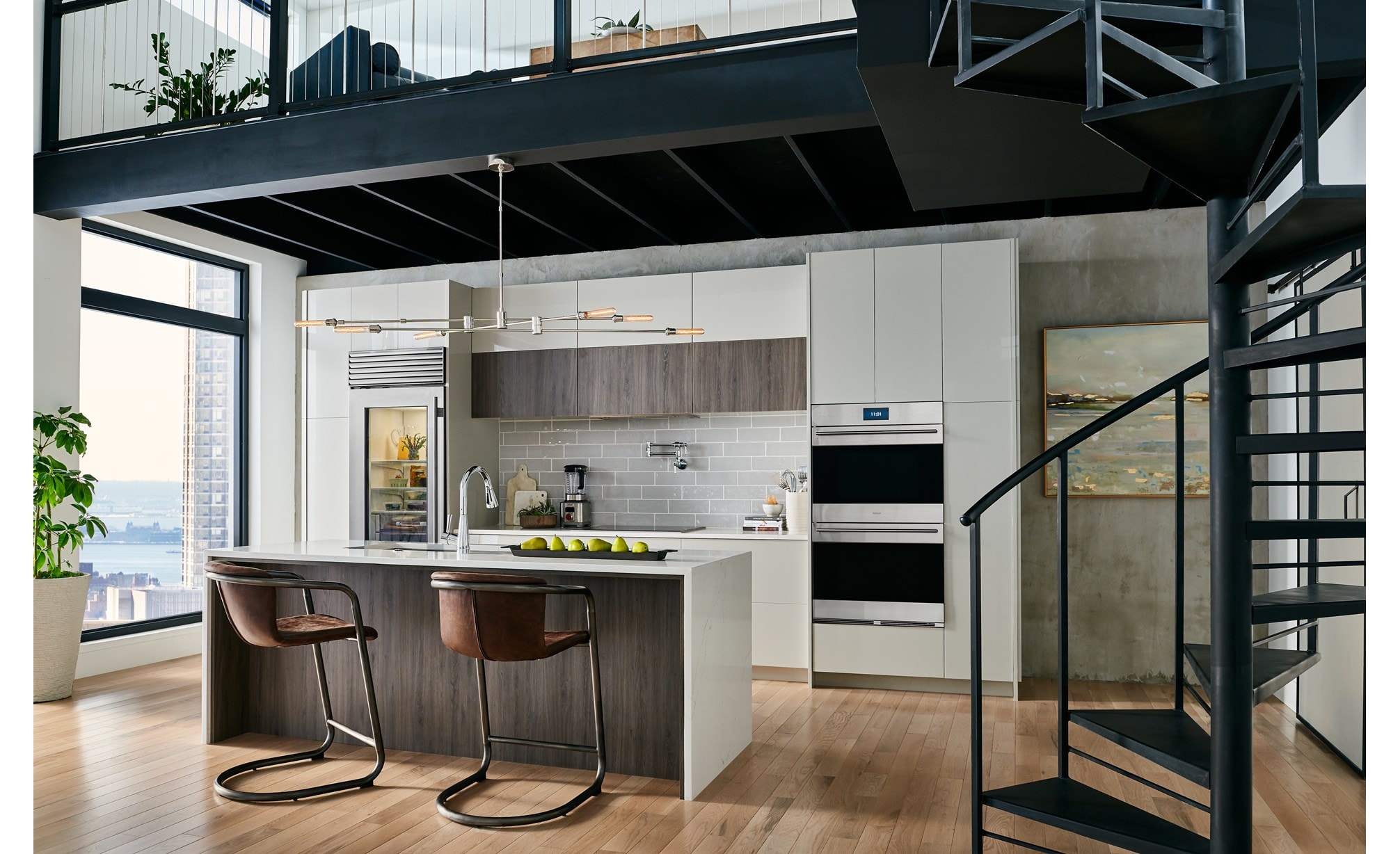 Wolf E Series (DO3050TE/S/T) Smart Double Wall Oven displayed in an elegant luxury loft featuring smooth light great handleless cabinets