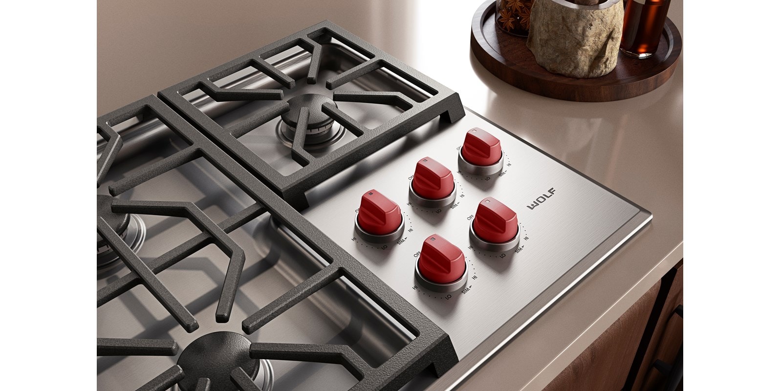 Wolf M Series 36 inch Gas Cooktop (Professional) shown with premium grade stainless steel and iconic red knobs.