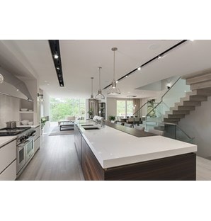 Wolf 48" Dual Fuel Range 6 Burner Infrared Charbroiler (DF486C) shown blending seamlessly into a sleek ultra-modern contemporary living space.