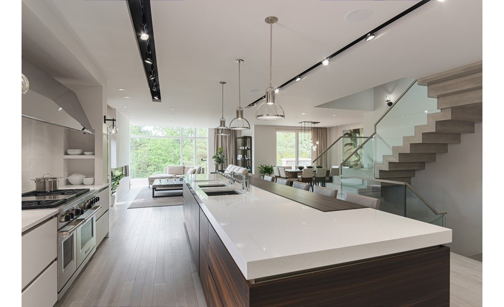 Wolf 48" Dual Fuel Range 6 Burner Infrared Charbroiler (DF486C) shown blending seamlessly into a sleek ultra-modern contemporary living space.