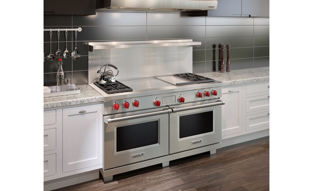 The Wolf 60" Dual Fuel Range 4 Burner Infrared Griddle French Top (DF604GF) with Wolf 60" Pro Wall Hood - 24" Depth (PW602418)