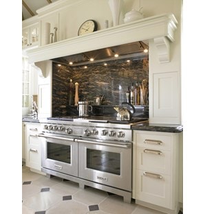 The Wolf 60" Dual Fuel Range 6 Burner Infrared Charbroiler Griddle (DF606CG) shown with signature stainless steel control knobs.