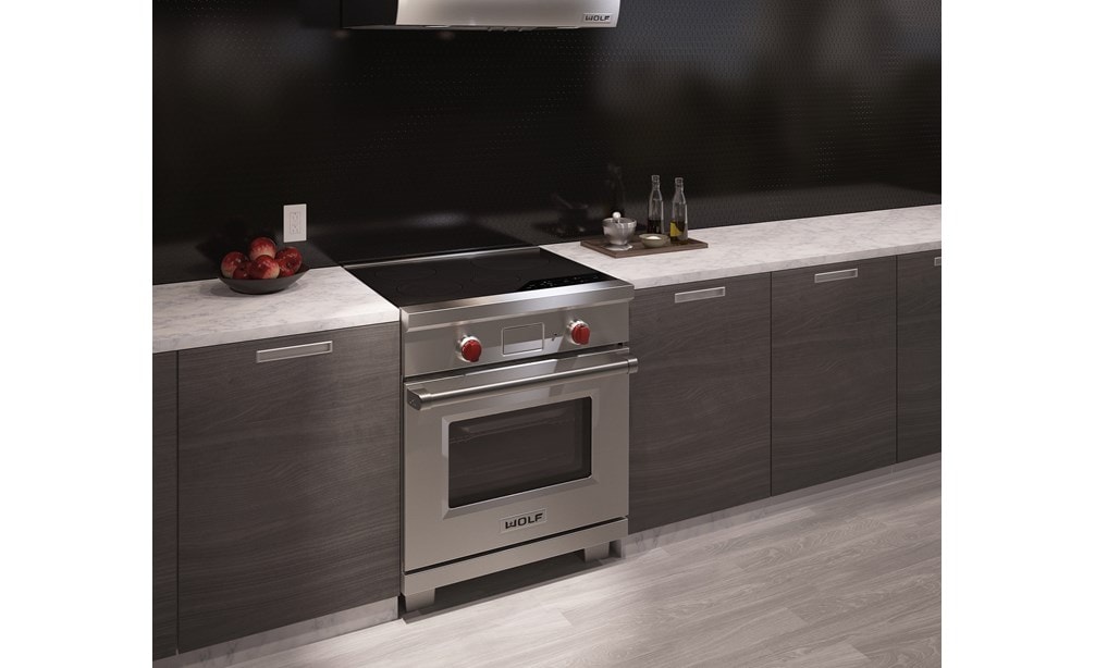The Wolf 30" Professional Induction Range (IR304PE/S/PH) shown with Wolf 30" Pro Wall Hood - 24" Depth (PW302418)