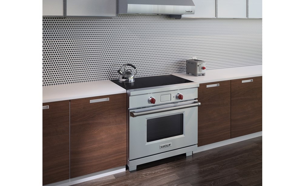 The Wolf 36" Professional Induction Range (IR365PE/S/PH) shown with Wolf Two-Slice-Toaster with Red Knob (WGTR102S)