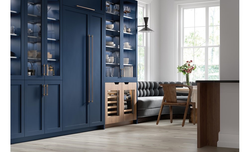 Sub-Zero 24" Designer Undercounter ADA Height Beverage Center - Panel Ready (DEU2450BG/ADA) with contrasting custom light brown and navy blue cabinetry 