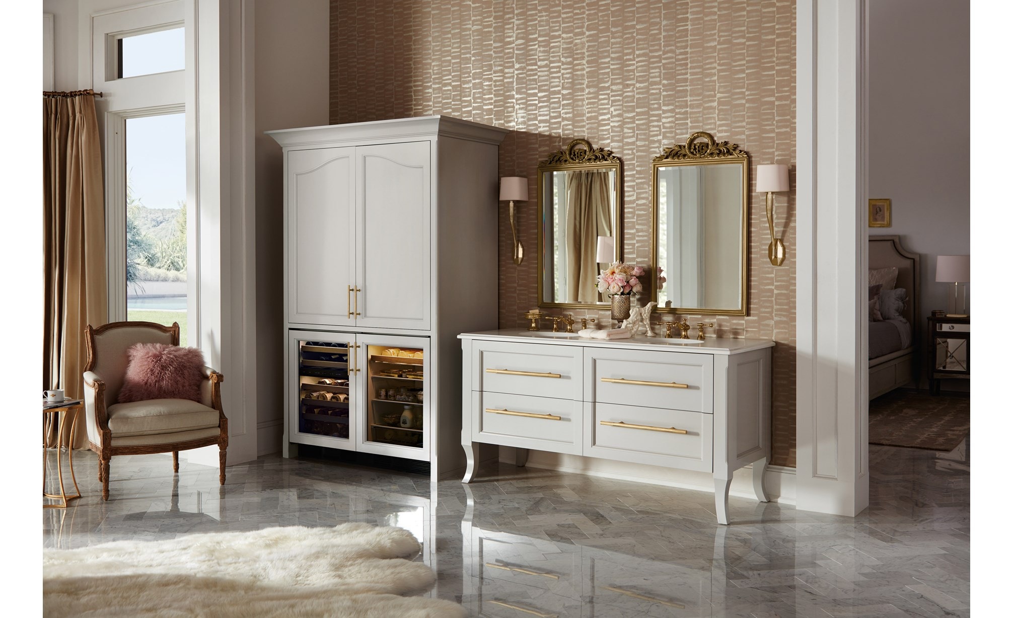 The Sub-Zero 24" Undercounter Beverage Center Panel Ready (UC- 24BG/O) shown blending experty into a rich classic room design