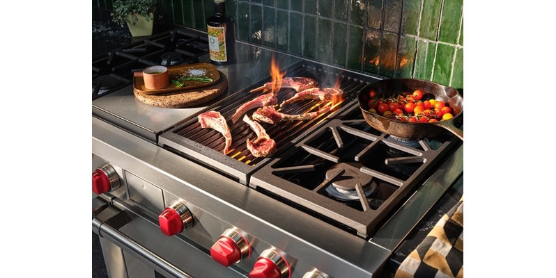 Wolf 48" Dual Fuel Range 4 Burner Infrared Charbroil Griddle (DF48450CG/S/P) shown in action searing meat and sauteing vegetables with finesse.