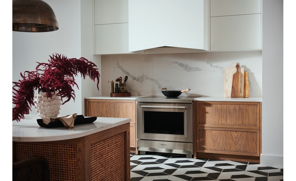 Wolf 36" Transitional Induction Range (IR36550/S/T) shown with Wolf 40" Pro Hood Liner (PL402212)