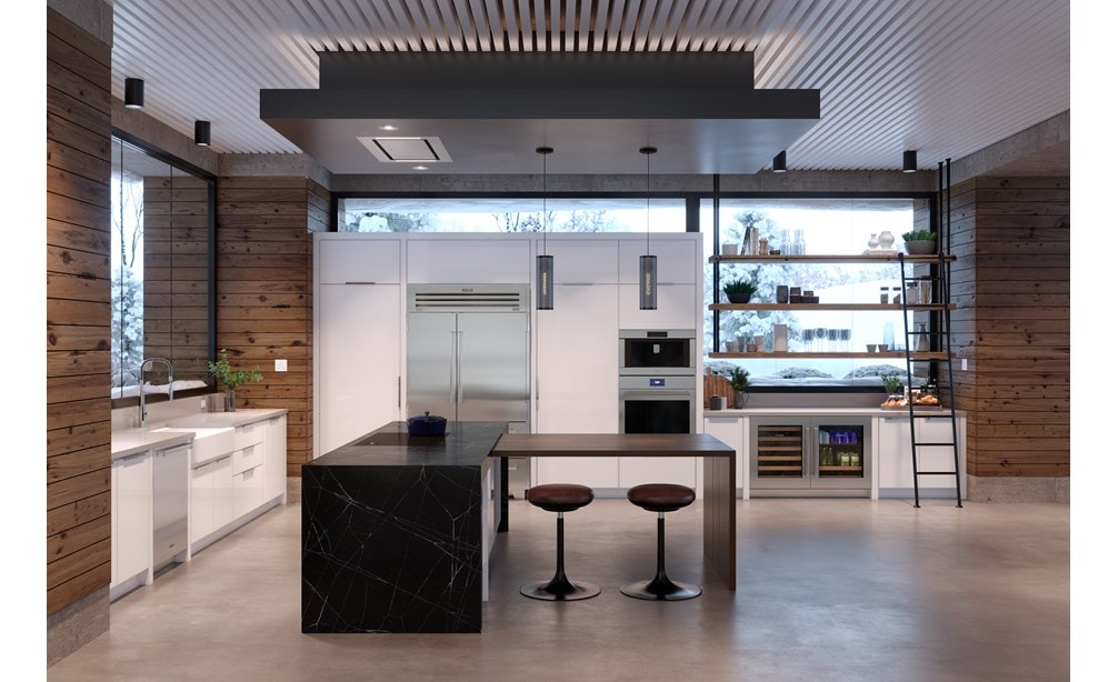 Surface de cuisson à induction Wolf 36 po de style contemporain qui se fond parfaitement dans un îlot de cuisine en marbre noir.