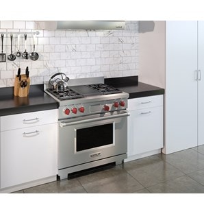 The Wolf 36" Dual Fuel Range 4 Burner Infrared Charbroiler (DF364C) shown in a clean contemporary kitchen design.
